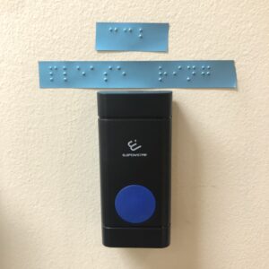 Braille above a doorbell.