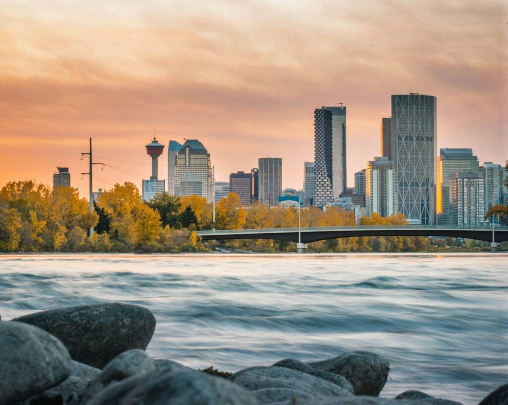 A view of the city of Calgary, Alberta, from across the water at sunset.